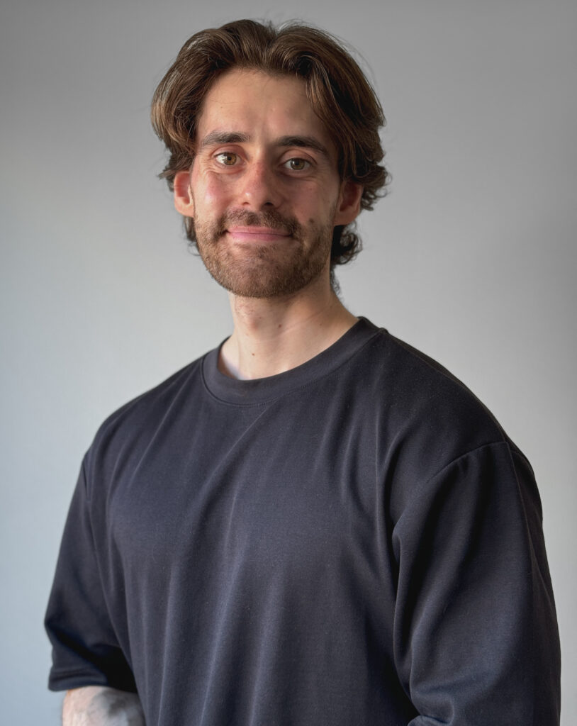 A headshot of MNU certified nutritionist and personal trainer John-Marco Ariza.