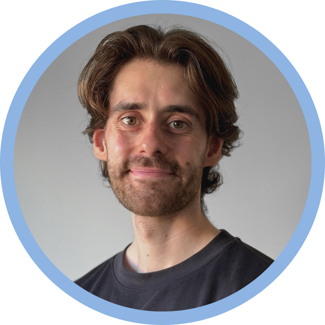 The logo of this website is a circular portrait photo of John-Marco Ariza.